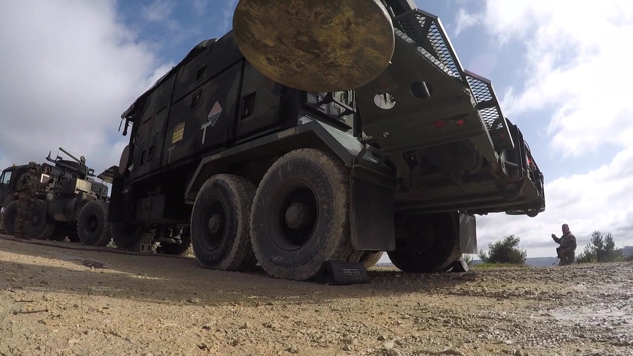 A missile system sits on a truck. 
