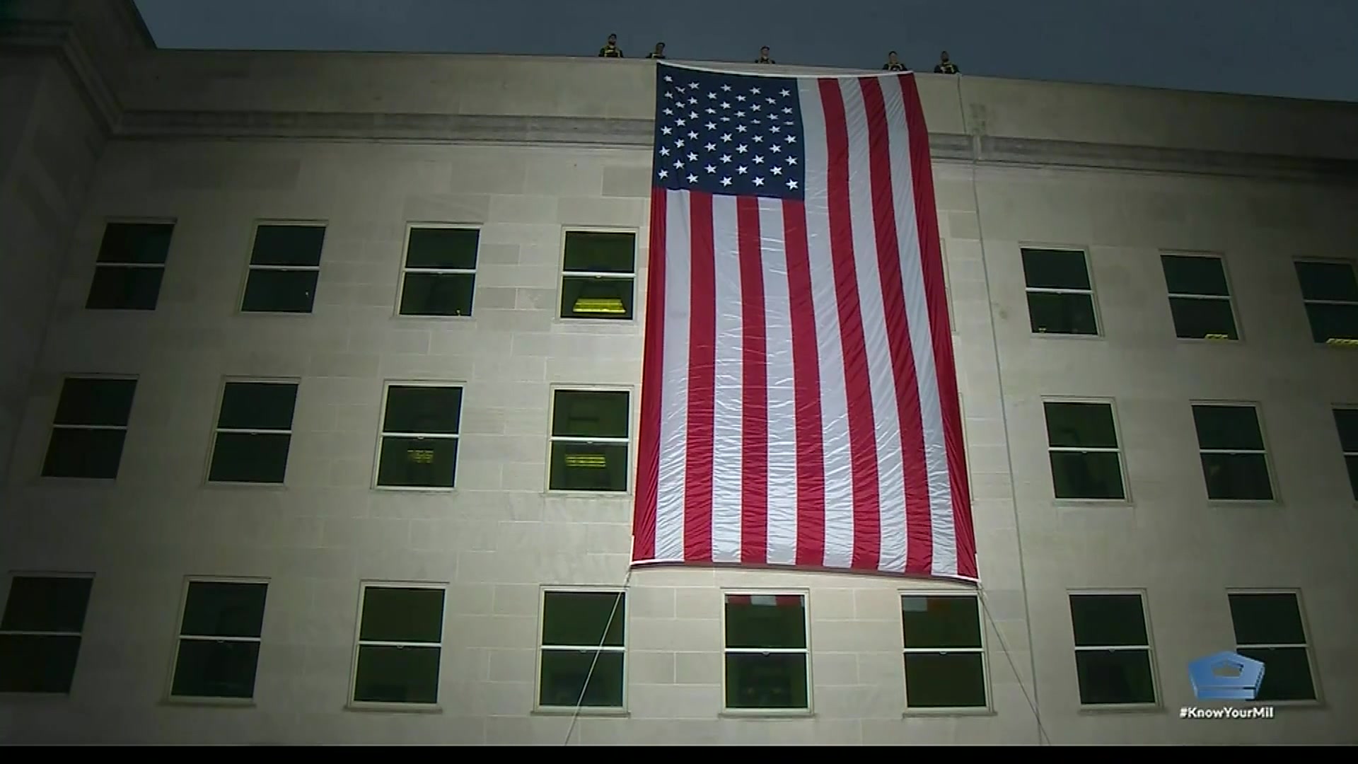 The U.S. flag is unfurled at sunrise on the west side of the Pentagon near the 9/11 Memorial in honor of those killed in the 9/11 terrorist attack, Sept. 11, 2019. The flag unfurling marks the anniversary and will be followed by both private and public ceremonies.