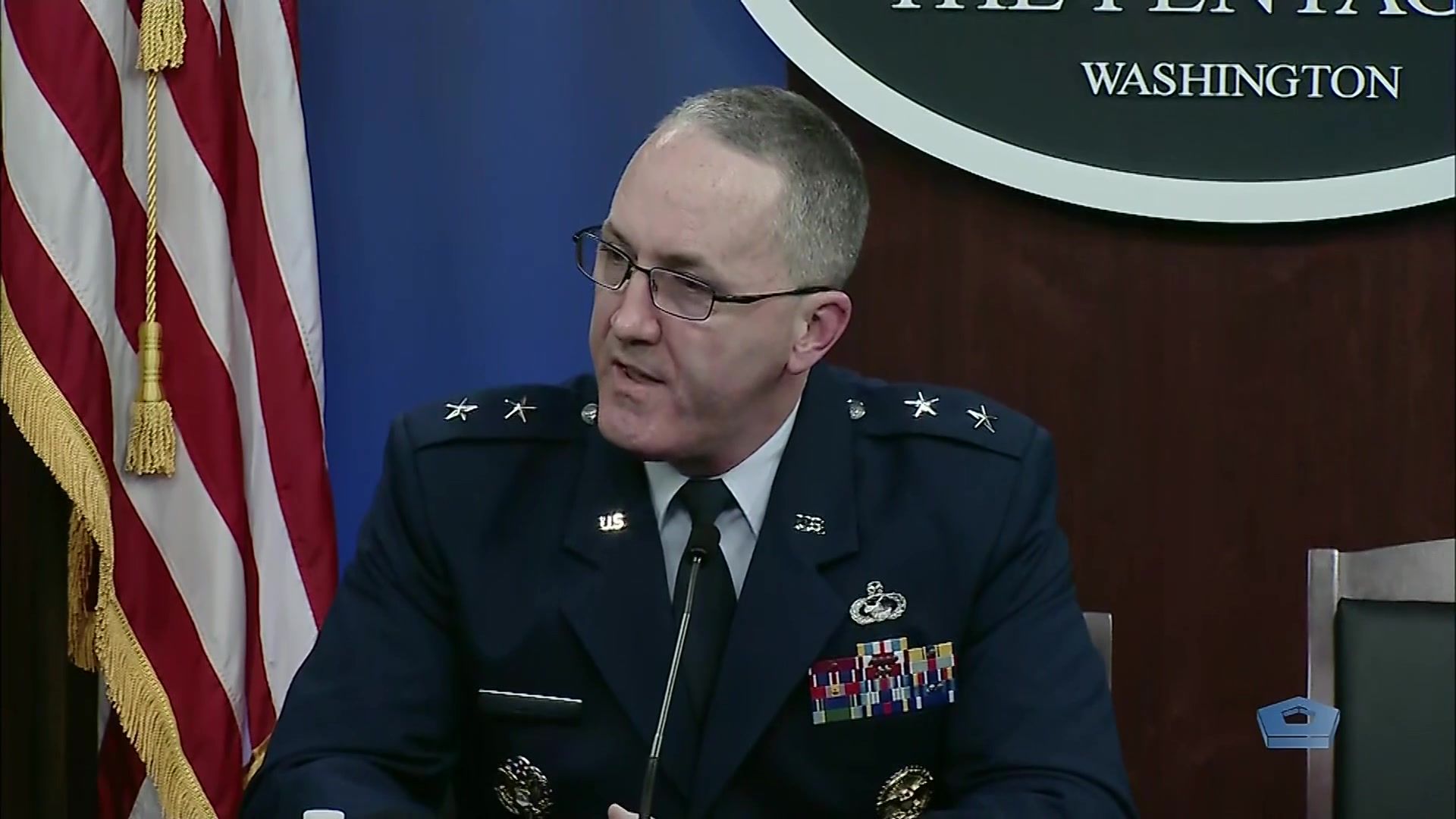 An Air Force general sits and speaks.