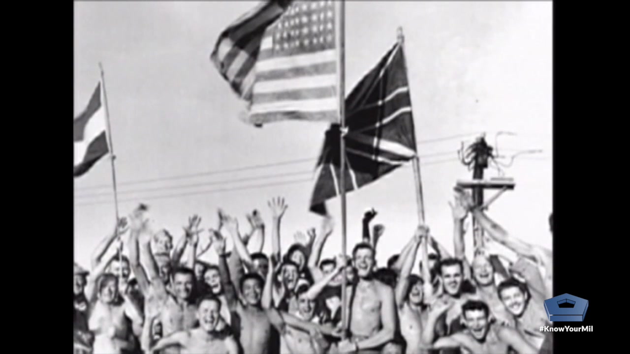 Victory in Japan day. The day World War II was won in the pacific theater. Historical footage of signing of surrender and Japanese laying down of arms.