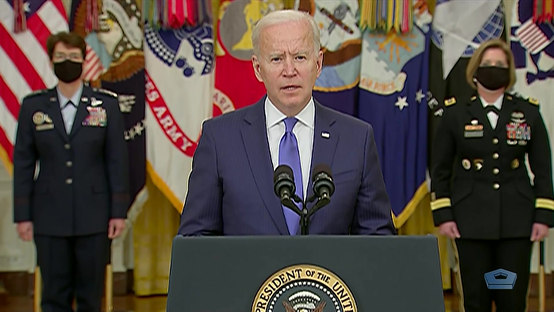 President Joe Biden speaks at a lectern. 
