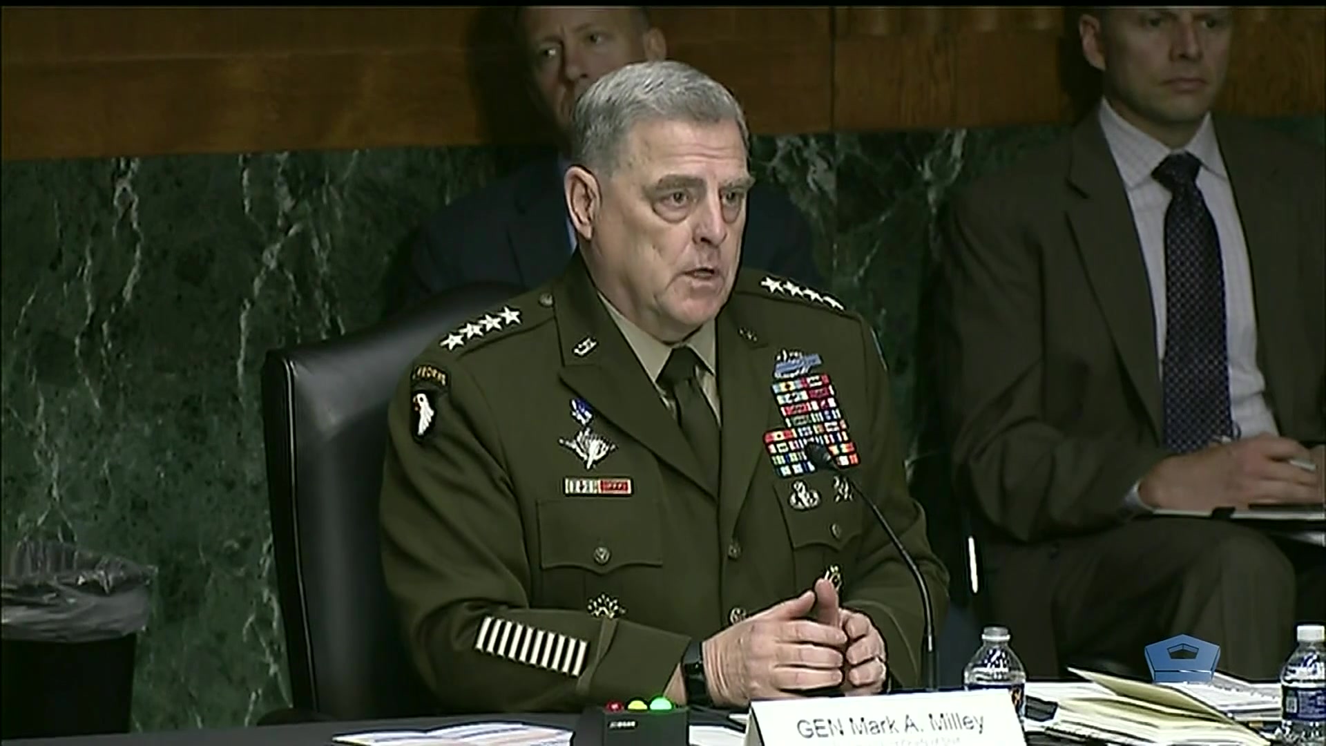 Army Gen. Mark A. Milley speaks at a table.