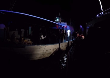 Coast Guard Cutter Bertholf boarding team interdict and board a fishing vessel towing multiple pangas suspected of trafficking illicit narcotics in the Eastern Pacific Ocean