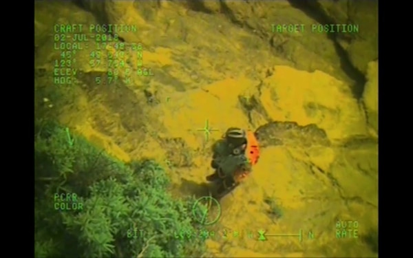 A Coast Guard aircrew aboard an MH-60 Jayhawk helicopter from Sector Columbia River rescues a man stranded 100 feet up a cliffside at Hug Point, Ore., July 2, 2018.