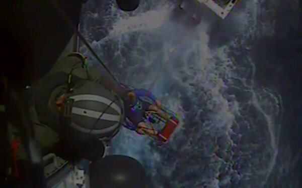 Crew members aboard an MH-60 Jayhawk helicopter from Coast Guard Air Station Clearwater hoist a 49-year-old man from a 25-foot fishing boat 70 miles north west of Anclote Key, Florida, Thursday, Aug. 16, 2018. The man suffered a diving related illness and was medevaced to Florida Hospital Orlando for further care. (U.S. Coast Guard video)