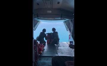 Coast Guard Air Station Miami HC-144 Ocean Sentry air crew drops lifesaving supplies to six migrants on March 3, 2021, Anguilla Cay, Bahamas. The migrants were later transferred to Bahamian authorities. (U.S. Coast Guard video)