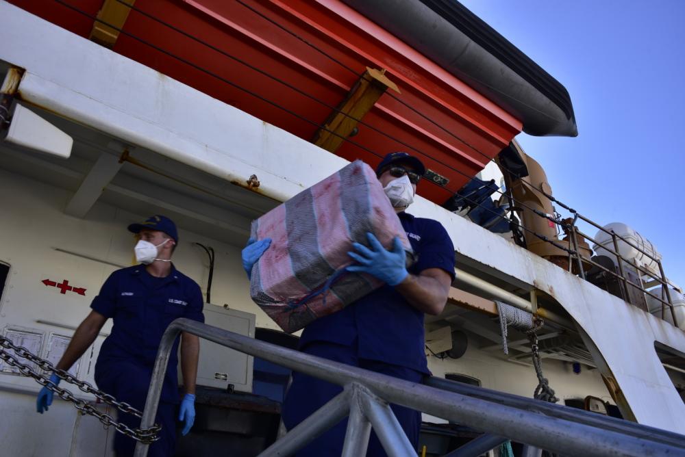 Coast Guard Cutter Dauntless' (WMEC-624) crew offloads more than $148 million in illegal narcotics at Base Miami Beach, Dec. 7, 2021. The contraband was seized by members of the Royal Fleet Auxiliary Wave Knight and the His Netherlands Majesty’s Ship Holland during three separate interdictions in the Caribbean Sea. (U.S. Coast Guard photo by Petty Officer 3rd Class Brian Zimmerman)