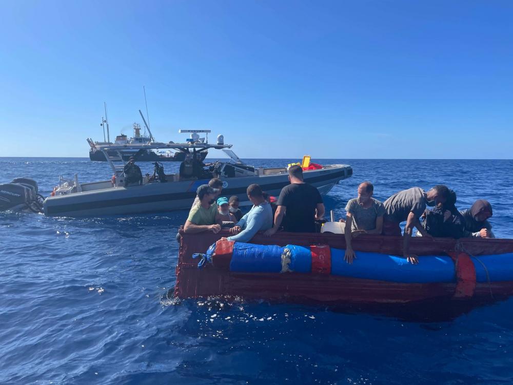 A Customs and Border Protection Air and Marine Operations boat crew and Coast Guard Cutter Charles Sexton’s small boat crew stop a vessel, Dec. 9, 2021, approximately 40 miles south of Key West, Florida. Coast Guard Cutter Raymond Evan's crew repatriated 30 people to Cuba Dec. 14 following four interdictions due to safety of life at sea concerns. (U.S. Coast Guard photo)