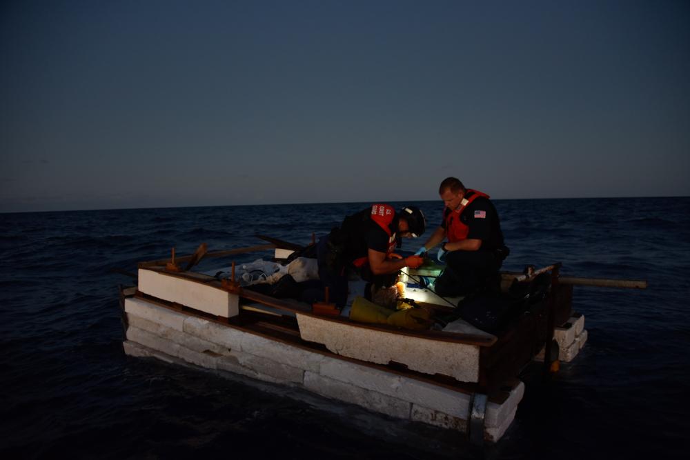 A Coast Guard Cutter Charles Sexton’s small boat crew stops a vessel, Dec. 9, 2021, approximately 45 miles south of Key West, Florida. Coast Guard Cutter Raymond Evan's crew repatriated 30 people to Cuba Dec. 14 following four interdictions due to safety of life at sea concerns. (U.S. Coast Guard photo by Petty Officer 3rd Class Jose Hernandez)