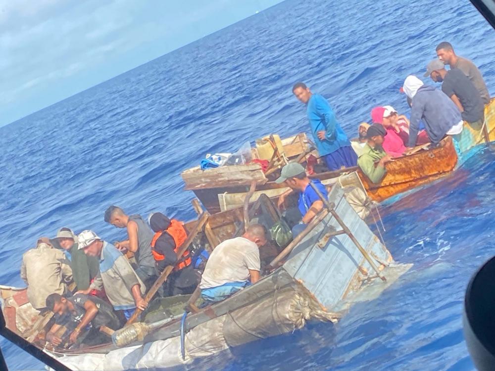 A towing vessel's crewmember notified Sector Key West watchstanders of two overloaded rustic vessels approximately 10 miles off Long Key, Florida, Dec. 20, 2021. The people were repatriated to Cuba, Dec. 24, 2021. (U.S. Coast Guard photo)
