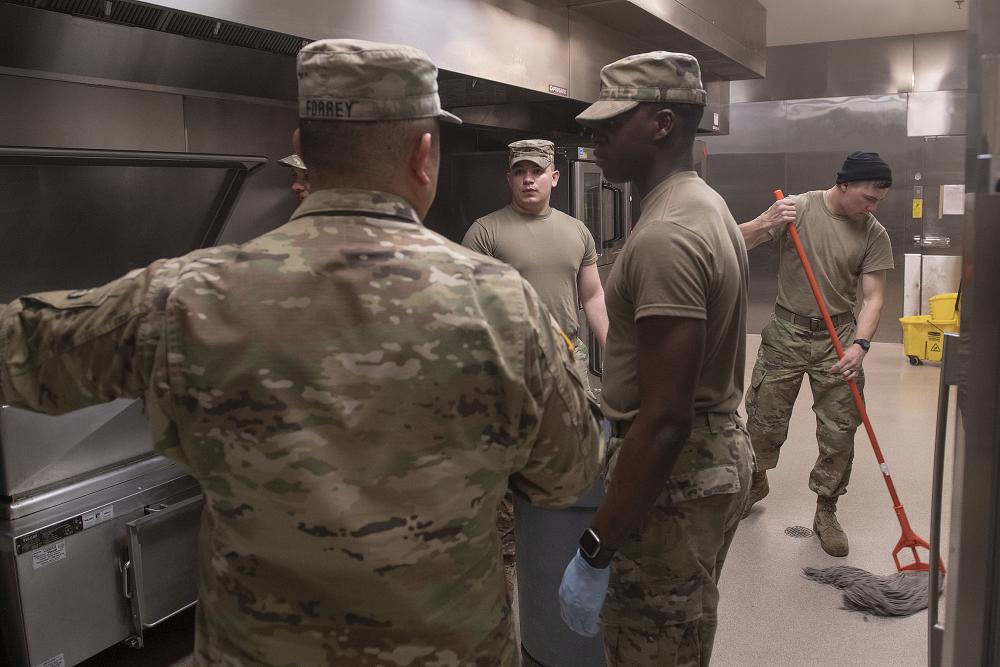 Soldiers doing PMCS in kitchen