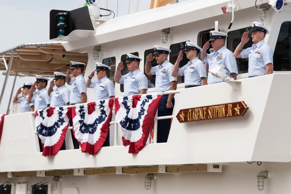 The commissioning crew of the USCGC Clarence Sutphin Jr. (WPC 1147), Patrol Forces Southwest Asia's sixth 154-foot Sentinel-class cutter, stand at attention as the ship is placed into service at a ceremony held at the Intrepid Sea, Air and Space Museum in New York City, April 21, 2022. 