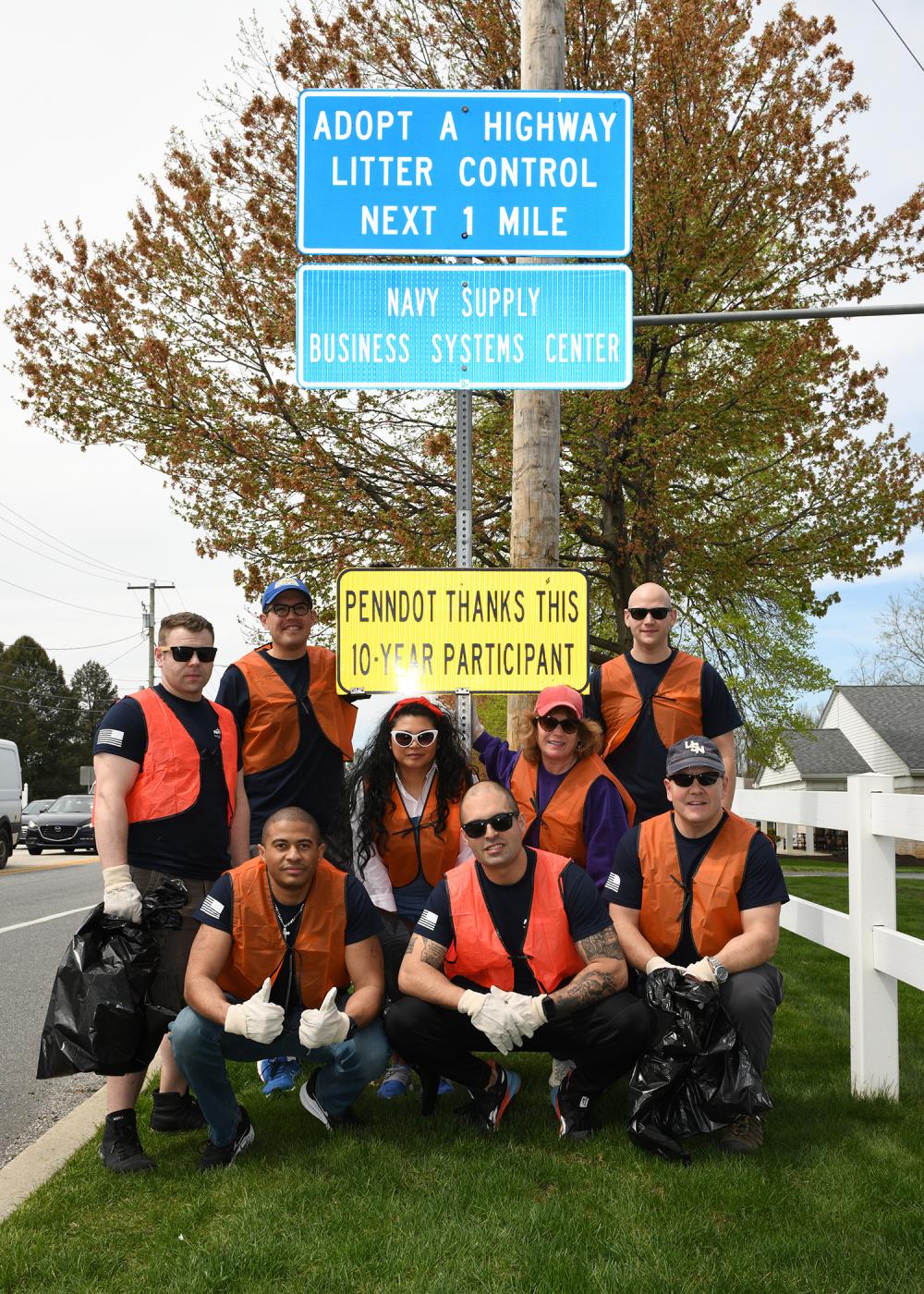 Navy Sailors, Civilians Clean Up Sporting Hill Road on Earth Day