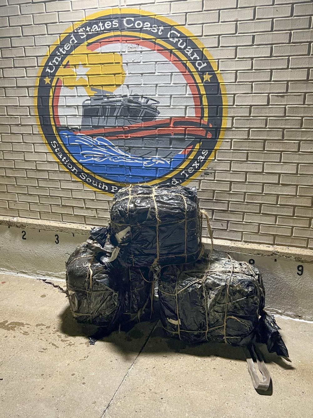Bales of marijuana seized by a Coast Guard Station South Padre Island 33-foot Special Purpose Craft–Law Enforcement boat crew lay stacked at Station South Padre Island near Brownsville, Texas, April 29, 2022. After witnessing three individuals swimming across the Brownsville Ship Channel, the SPC–LE crew intercepted them and seized the 168 pounds of marijuana in their possession. (U.S. Coast Guard photo, courtesy Station South Padre Island)
