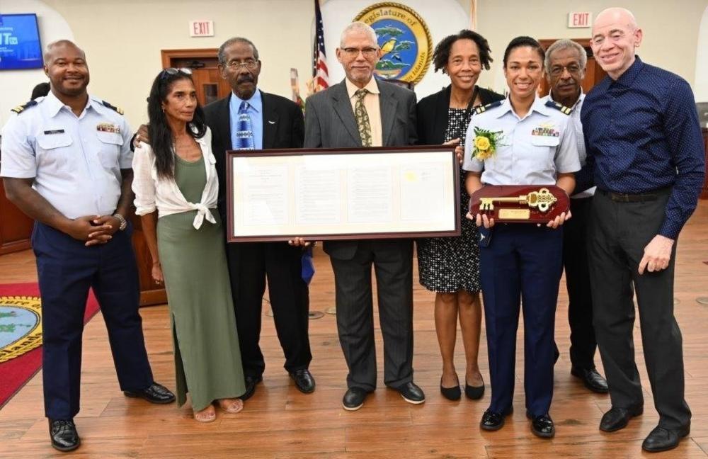 Lt. Ronaqua Russell, A U.S. Coast Guard HC-144 pilot with Air Station Miami, holds the Key to the U.S. Virgin Islands, presented to her by the U.S. Virgin Islands Legislature May 5, 2022 in honor of her achievements as an aviator, including becoming the first Black woman in the Coast Guard to win the Air Medal. The award recognized her skill and excellence as a pilot during the 2017 hurricane season, first in Hurricane Harvey and later during Hurricane Maria. (Courtesy photo by Barry Leerdam, Legislature of the Virgin Islands)