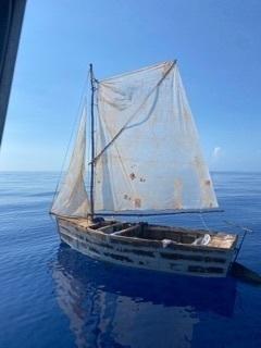 A Custom and Border Protection Air and Marine Operations law enforcement air crew alerted Coast Guard Sector Key West watchstanders of this rustic vessel, about 45 miles south of Islamorada, Florida, May 6, 2022. They people were repatriated to Cuba on May 9, 2022. (U.S. Coast Guard photo)