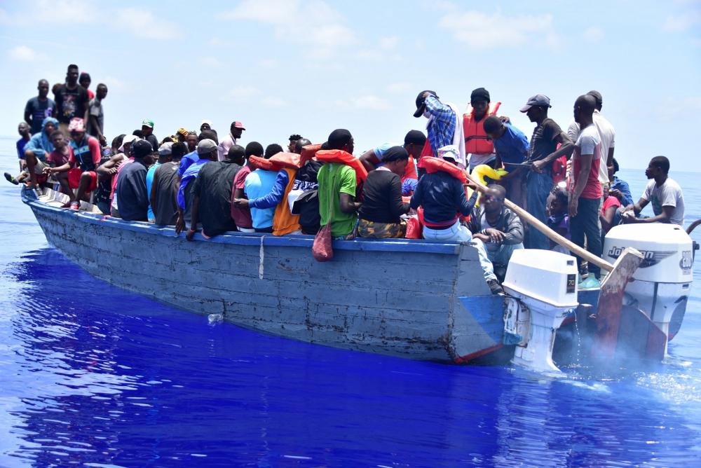 A Coast Guard Cutter Campbell law enforcement crew stopped a grossly overloaded, unsafe vessel near Turks and Caicos, May 9, 2022. Coast Guard Cutter Campbell is homeported in Kittery, Maine. (U.S. Coast Guard photo by Petty Officer 3rd Class Erik Villa-Rodriguez)