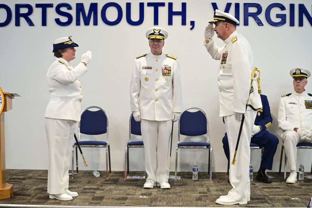 Rear Adm. Shannon Gilreath, incoming 5th District commander, salutes Rear Adm. Laura Dickey as he relieves her as district commander during the 5th District's change-of-command ceremony in Portsmouth, Virginia, May 11, 2022. The change of command is a time-honored tradition that promotes continuity and authority of command within the Coast Guard. U.S. Coast Guard photo by Petty Officer 3rd Class Emily Velez.