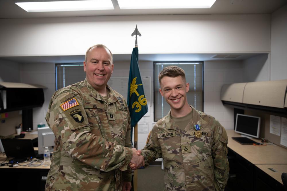 Private First Class Carlsson receives Army Achievement Medal