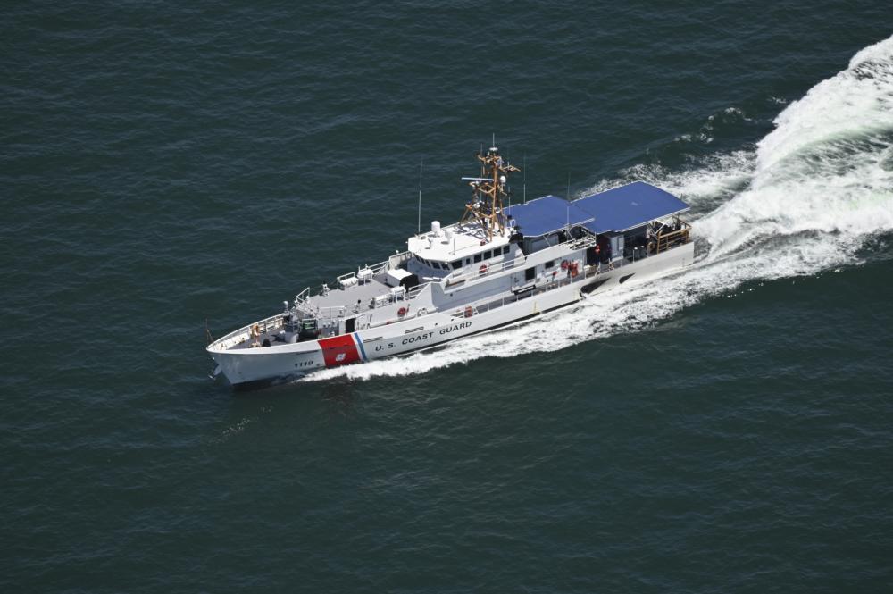 The Coast Guard Cutter Rollin Fritch cruises to rendezvous with a Navy MH-60 Seahawk aircrew, set to perform a simulated rescue of two Air Force First Lieutenants from Seymour Johnson Air Force Base from the deck of the cutter as part of the joint service Search and Rescue Exercise, May 17, 2022, near Ocean City, Maryland. The Search and Rescue Exercise is an annual event that prepares the Coast Guard, Navy, and Air Force for search and rescue situations that may arise that involve coordination among the services. (U.S. Coast Guard photo by Petty Officer Third Class Emily Velez)