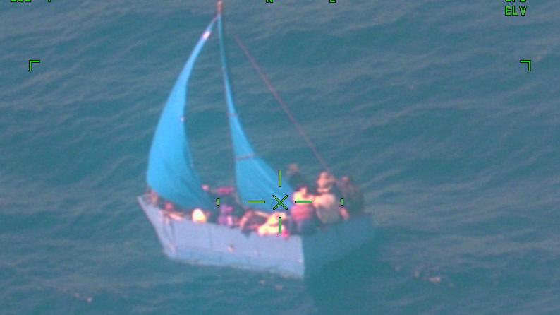 A Coast Guard Air Station Miami HC-144 Ocean Sentry law enforcement air crew alerted Coast Guard Sector Key West watchstanders of a rustic vessel about 65 miles south of Key West, Florida, May 15, 2022. The people were repatriated to Cuba May 19, 2022. (U.S. Coast Guard photo)