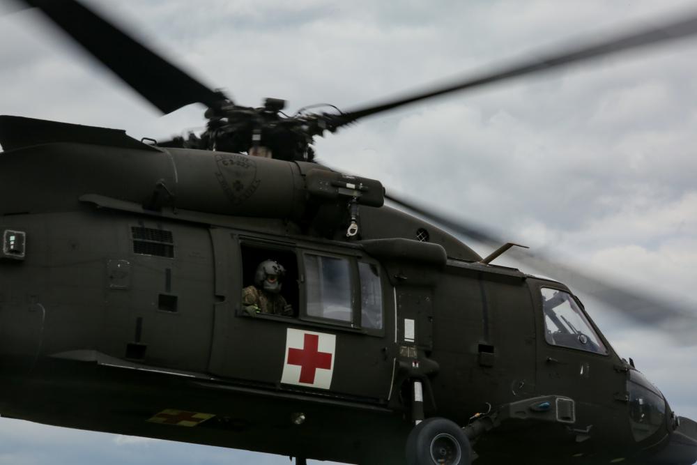 Soldiers conduct medical evacuation training in a MH-60 Blackhawk.