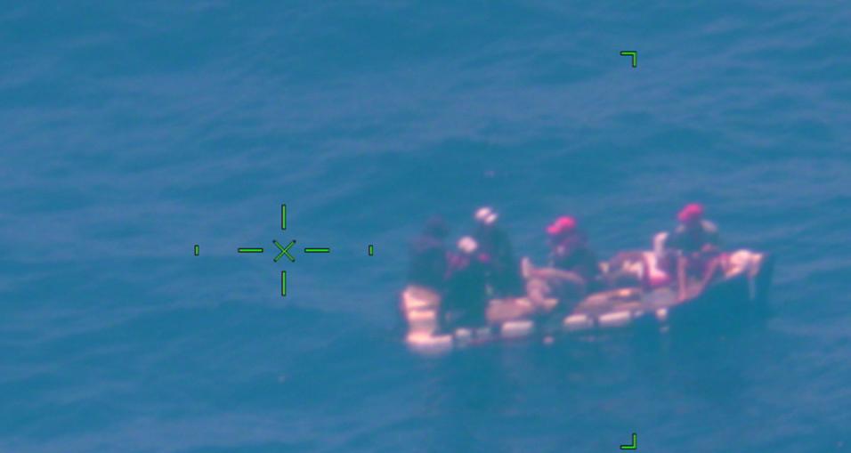 A Coast Guard Air Station Miami HC-144 Ocean Sentry law enforcement aircrew alerted Coast Guard Sector Key West watchstanders of a rustic vessel about 55 miles southwest of Key West, Florida, May 27, 2022. The people were repatriated on May 31, 2022. (U.S. Coast Guard photo by Air Station Miami)