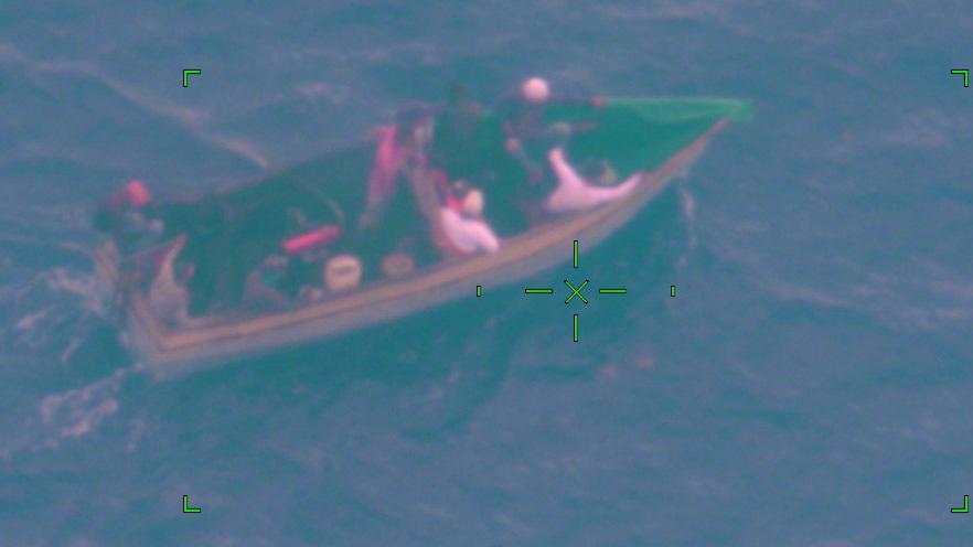 An Air Station Miami HC-144 Ocean Sentry aircrew alerted Sector Key West watchstanders of a rustic vessel about 50 miles southwest of Marquesas Key, Florida, June 6, 2022. The people were repatriated to Cuba on June 9, 2022. (U.S. Coast Guard photo by Air Station Miami)