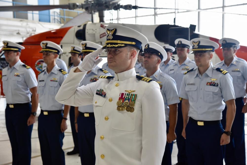 Cmdr. Jake Smith, Air Station Borinquen chief of operations, leads a formation during the unit’s change of command ceremony June 17, 2022 at the base aircraft hangar in Aguadilla, Puerto Rico. During the ceremony, Capt. Lawrence Gaillard relieved Capt. Tina Peña as the new commanding officer of Air Station Borinquen. (U.S. Coast Guard photo by Ricardo Castrodad)