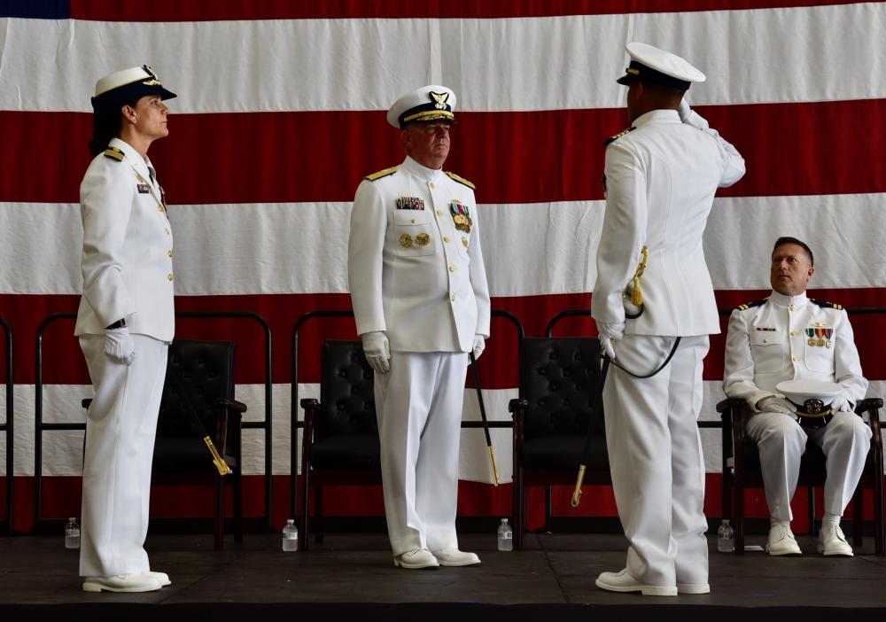 Capt. Lawrence Gaillard (right), Rear Adm. Brendan C. McPherson (center), and Capt. Tina Peña (left) during Air Station Borinquen's Change of Command in Aguadilla, Puerto Rico June 17, 2022. During the ceremony, Capt. Gaillard relieved Capt. Peña as the new commanding officer of Air Station Borinquen. (U.S. Coast Guard photo by Ricardo Castrodad)