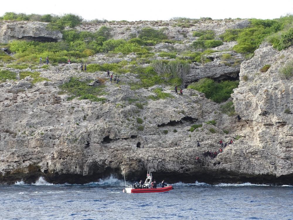 Coast Guard Cutter Joseph Doyle’s boat crew during the rescue of 27 Haitians on Isla Monito, Puerto Rico June 7, 2022.  The Haitian group was rescued after being left stranded, following an illegal voyage in the Mona Passage. (U.S. Coast Guard photo)