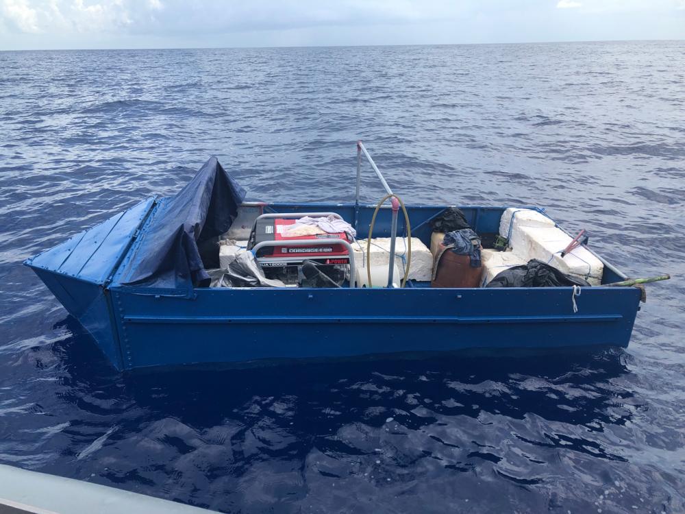 U.S. Coast Guard Cutter Sexton's (WPC 1108) boat crew alerted Coast Guard Sector Key West watchstanders of a rustic vessel partially submerged about 9 miles south of Boot Key, June 20, 2022.The people were repatriated to Cuba on June 23, 2022. (U.S. Coast Guard photo)