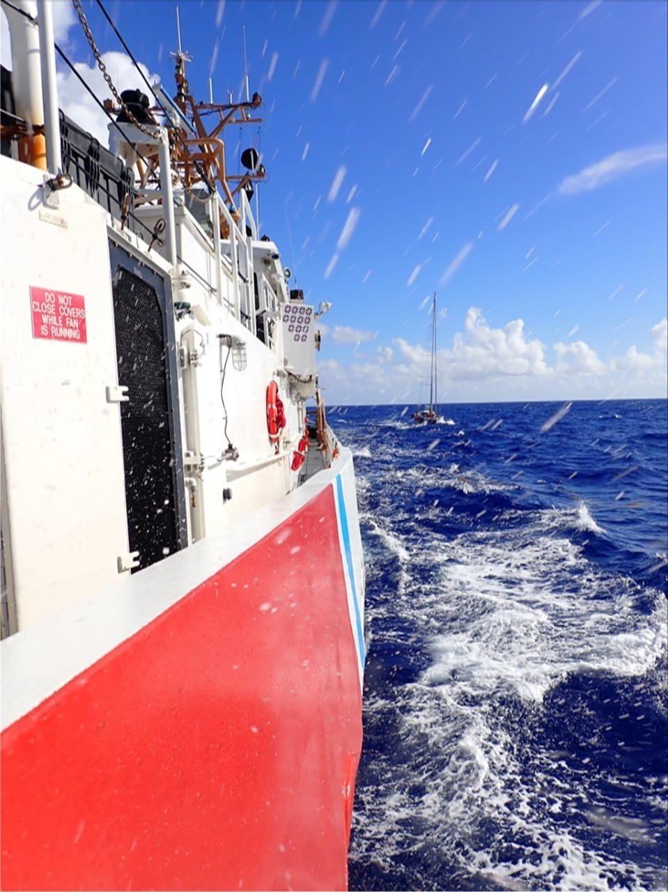 The Coast Guard Cutter Joseph Tezanos tows the sailing vessel Valour in the Atlantic Ocean June 24, 2022, approximately 300 nautical miles north of Puerto Rico. The four-day response involved Coast Guard air and surface crews, which rescued three mariners, U.S. citizens, and brought the sailing vessel to safe harbor in Fajardo, Puerto Rico the morning of June 26, 2022.