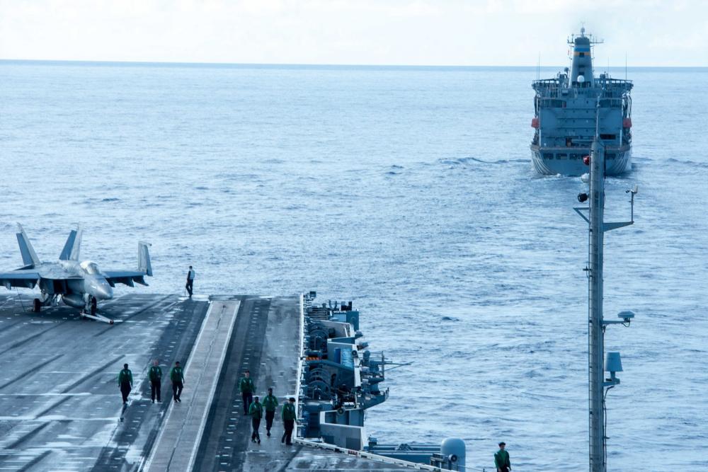 USS Ronald Reagan (CVN-76) Sailors conduct a fueling-at-sea with USNS Yukon (T-AO 202)