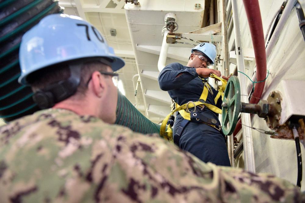 Sailors learn fall protection safety in the hangar bay of Nimitz-class aircraft carrier USS Carl Vinson