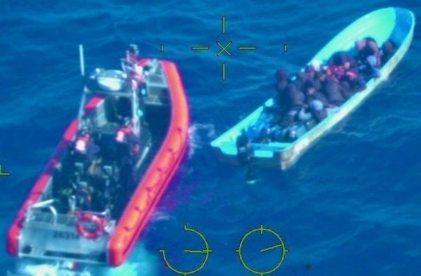 The Coast Guard Cutter Joseph Tezanos is on-scene with a makeshift vessel interdicted July 28, 2022 off the northwest coast of Puerto Rico. Seventeen Dominicans, 15 male and 2 females including two minors, who were taking part in this illegal voyage were repatriated to a Dominican Republic Navy vessel July 29, 2022 along with 19 other Dominicans from a separate interdiction. (U.S. Coast Guard photo)