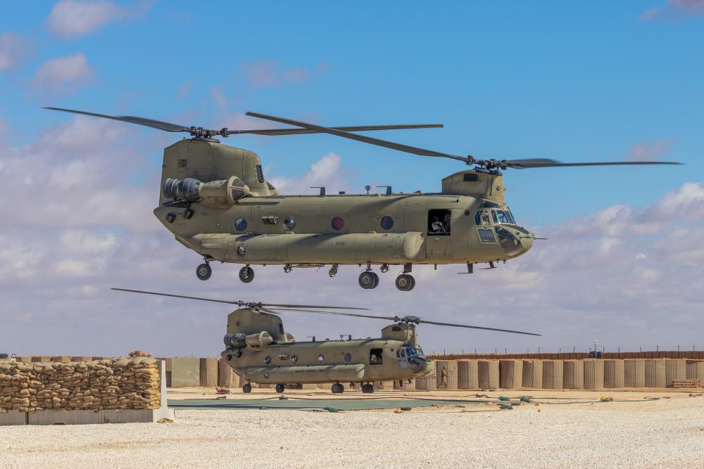 2 CH-47 Chinooks take off during mission