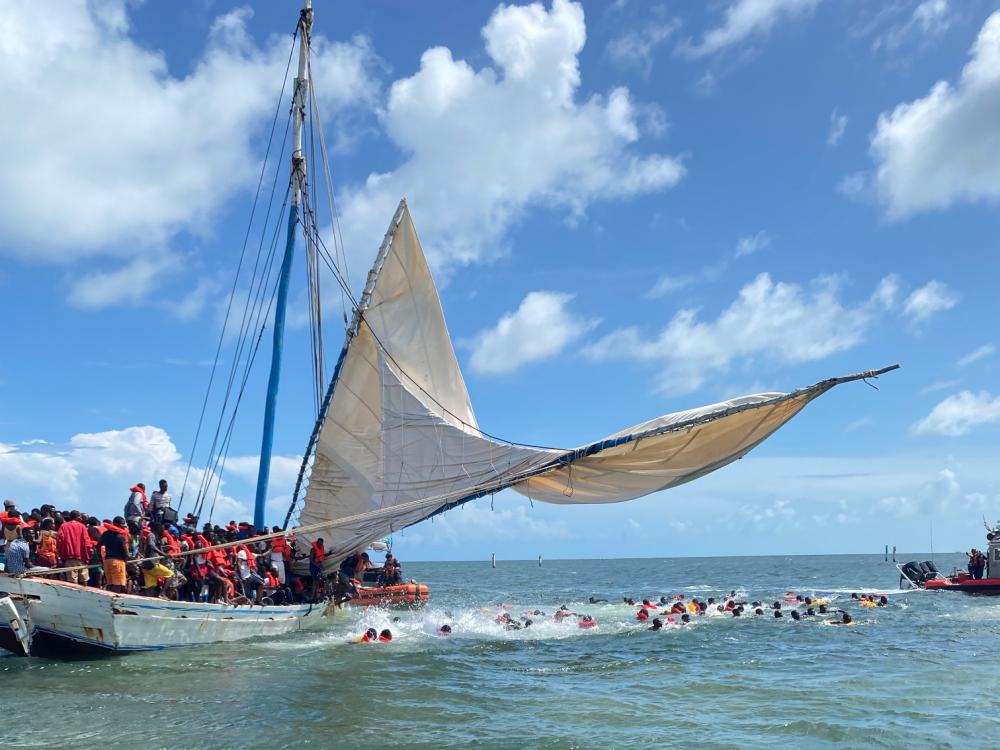 Haitian migrants enter the water after their vessel capsized off Ocean Reef, Florida, Aug. 6, 2022. The people were repatriated to Haiti on Aug. 9, 2022. (U.S. Coast Guard photo by Station Islamorada's crew)