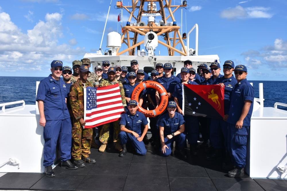 The USCGC Oliver Henry (WPC 1140) crew, including ship riders from Papua New Guinea, the U.S. Marine Corps, and the U.S. Navy, take a moment for a photo aboard the ship off Manus, Papua New Guinea, Aug. 14, 2022. 