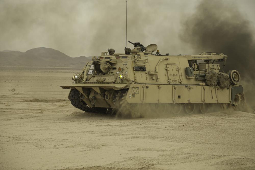 Soldiers assigned to the 1st Infantry Division maneuver a M88A2 recovery vehicle at the National Training Center, Fort Irwin, Calif