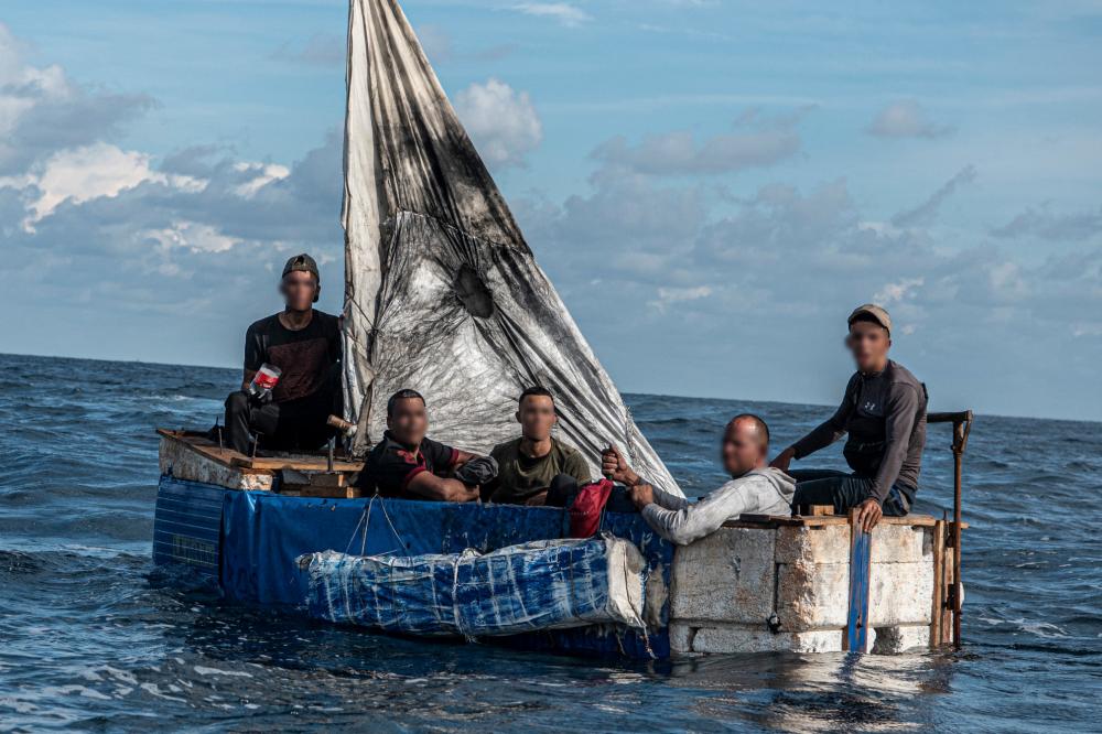 Coast Guard Cutter Adler's crew alerted Sector Key West watchstanders of this rustic vessel about 18 miles south of Key West, Sept. 9, 2022. The people were repatriated to Cuba Sept. 11, 2022. (U.S. Coast Guard photo by Petty Officer 2nd Class Ronald Hodges)