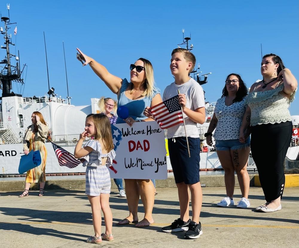 Family and friends of the USCGC Bear (WMEC 901) stand on the pier in Portsmouth, Virginia, Monday.