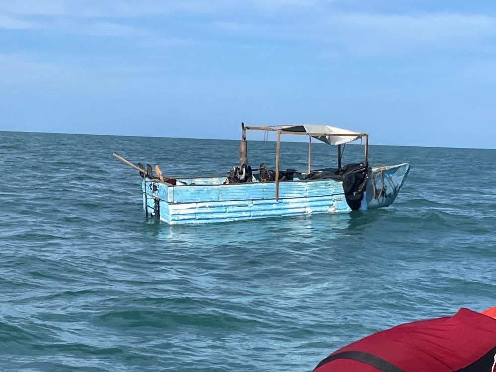 A good Samaritan notified Sector Key West watchstanders of a rustic vessel about 5 miles southwest of Marquesas Key, Florida, Oct. 10, 2022. The people were repatriated to Cuba on Oct. 14, 2022. (U.S. Coast Guard photo)