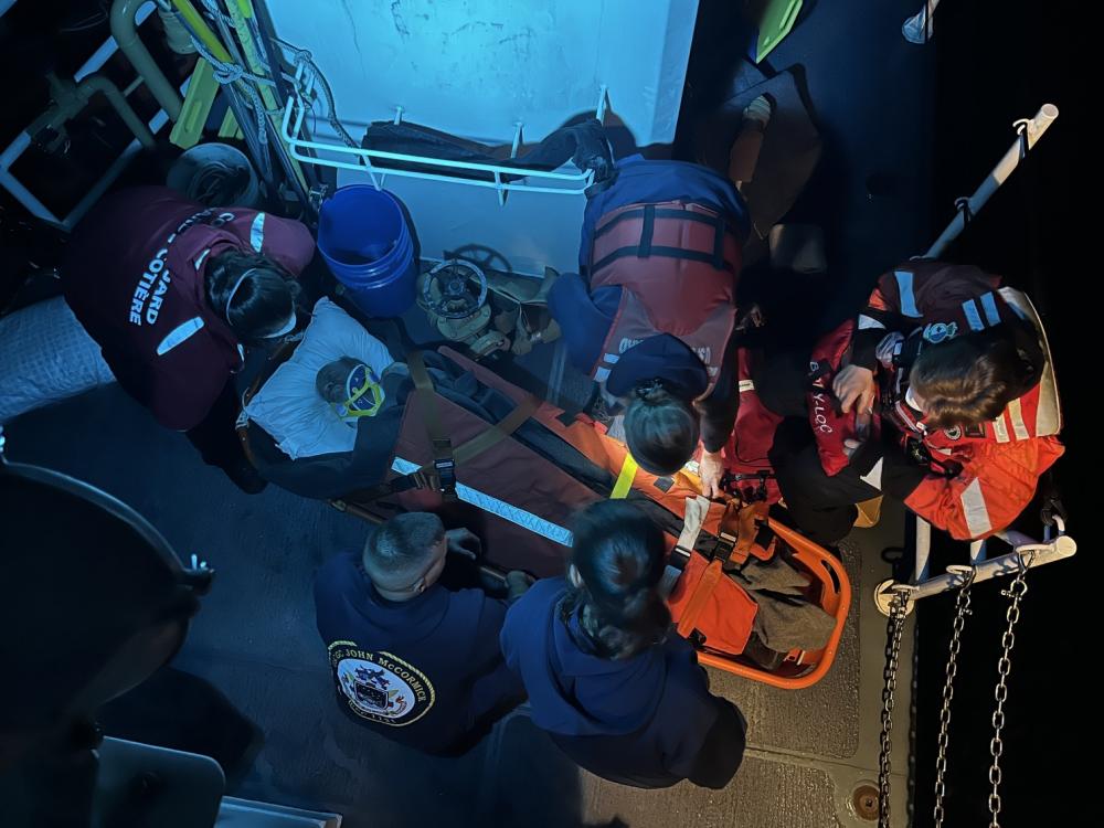 The crew of U.S. Coast Guard Cutter John McCormick medevacs an injured fisherman Oct. 15, 2022, off Vancouver Island, British Columbia, Canada. The John McCormick crew placed the patient in the care of the Canadian Coast Guard Patrol Vessel M. Charles M.B. crew, who brought him to EMS in Port McNeill. U.S. Coast Guard photo courtesy of Cutter John McCormick