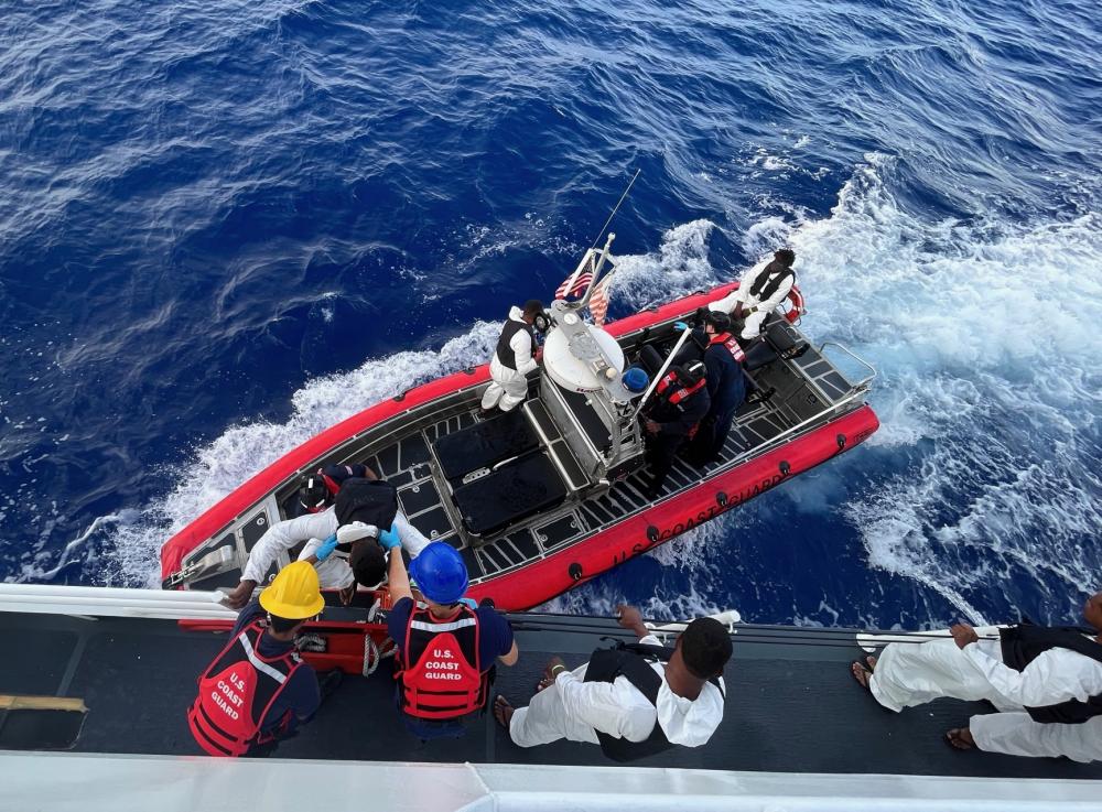 Coast Guard Cutter Heriberto Hernandez's crew repatriates 41 people to a Dominican Republic Navy vessel just off the Dominican Republic Oct. 31, 2022. The group was interdicted Oct. 28, 2022 aboard a grossly overloaded makeshift vessel during an illegal voyage in the Mona Passage. (U.S. Coast Guard photo).