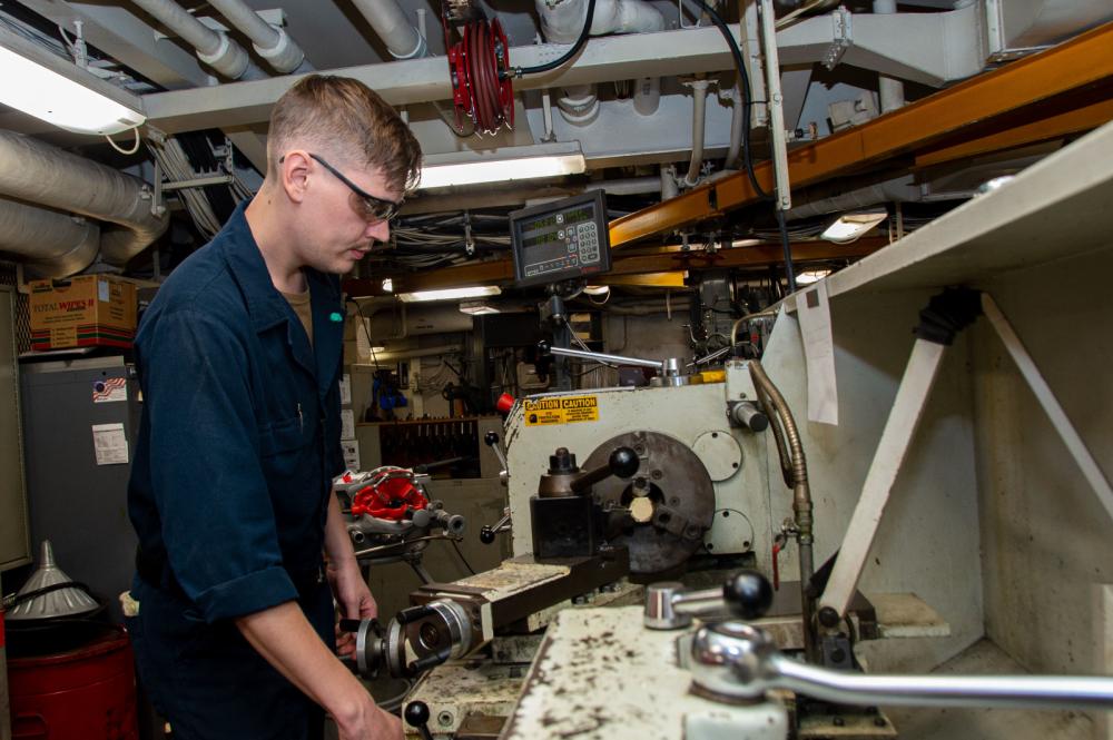 USS Ronald Reagan (CVN 76) Sailors work in the machine shop