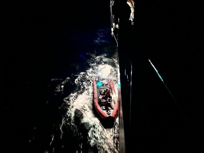 A Coast Guard Cutter Escanaba small boat rescue crew pulls alongside the Cutter Escanaba near Rodriguez Key, Florida, Nov. 22, 2022. The people were repatriated to Haiti on Nov. 25, 2022. (U.S. Coast Guard photo by Lt. Robert Collins)