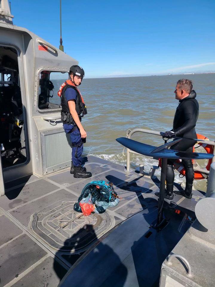 A Coast Guard Station Galveston 45-foot Response Boat–Medium crew rescues a kite surfer from the water Nov. 26, 2022, near Texas City, Texas. The man was transferred to a Station Galveston 29-foot Response Boat–Small and safely transported to awaiting Texas City Fire Department personnel at the Texas City Dike. (U.S. Coast Guard photo, courtesy Station Galveston)