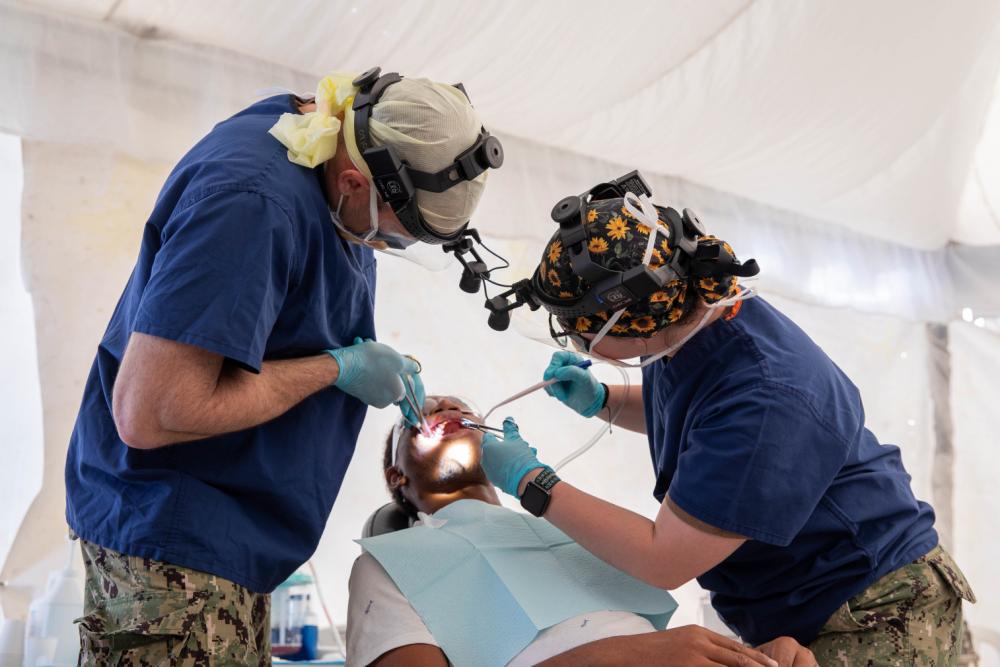 U.S. Navy Sailors assigned to the USNS Comfort perform medical and dental care at medical site in Azua, Dominican Republic during Continuing Promise 2022
