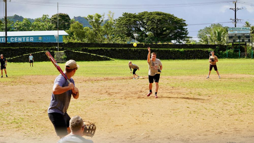 The crew of the USCGC Frederick Hatch (WPC 1143) play softball with the U.S. Navy Seabees against local youth in Pohnpei, Federated States of Micronesia, on Nov. 22, 2022. 